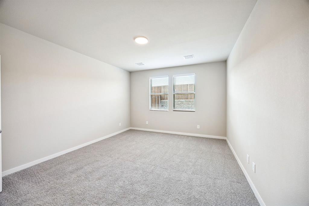 144 Millwood Road Lavon, TX 75166 - Photo 19 of 37 an empty room with windows