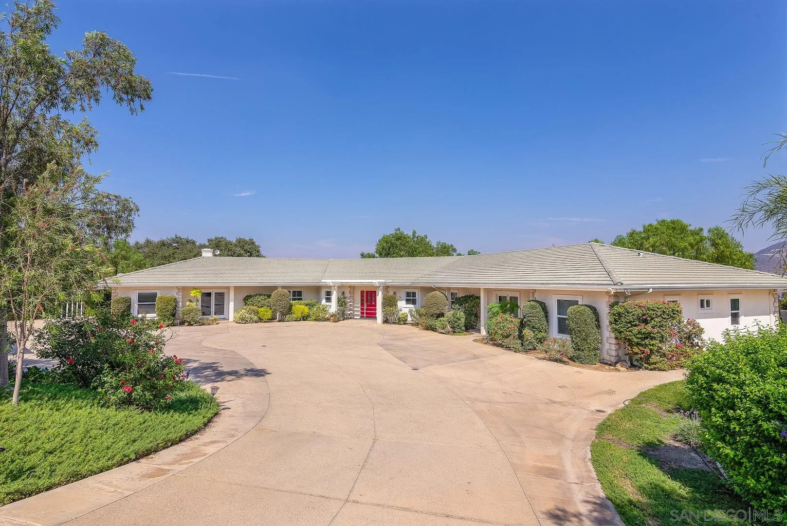 3880 Dos Ninos Road Fallbrook, CA 92028 - Photo 1 of 39 a view of a white house with a yard