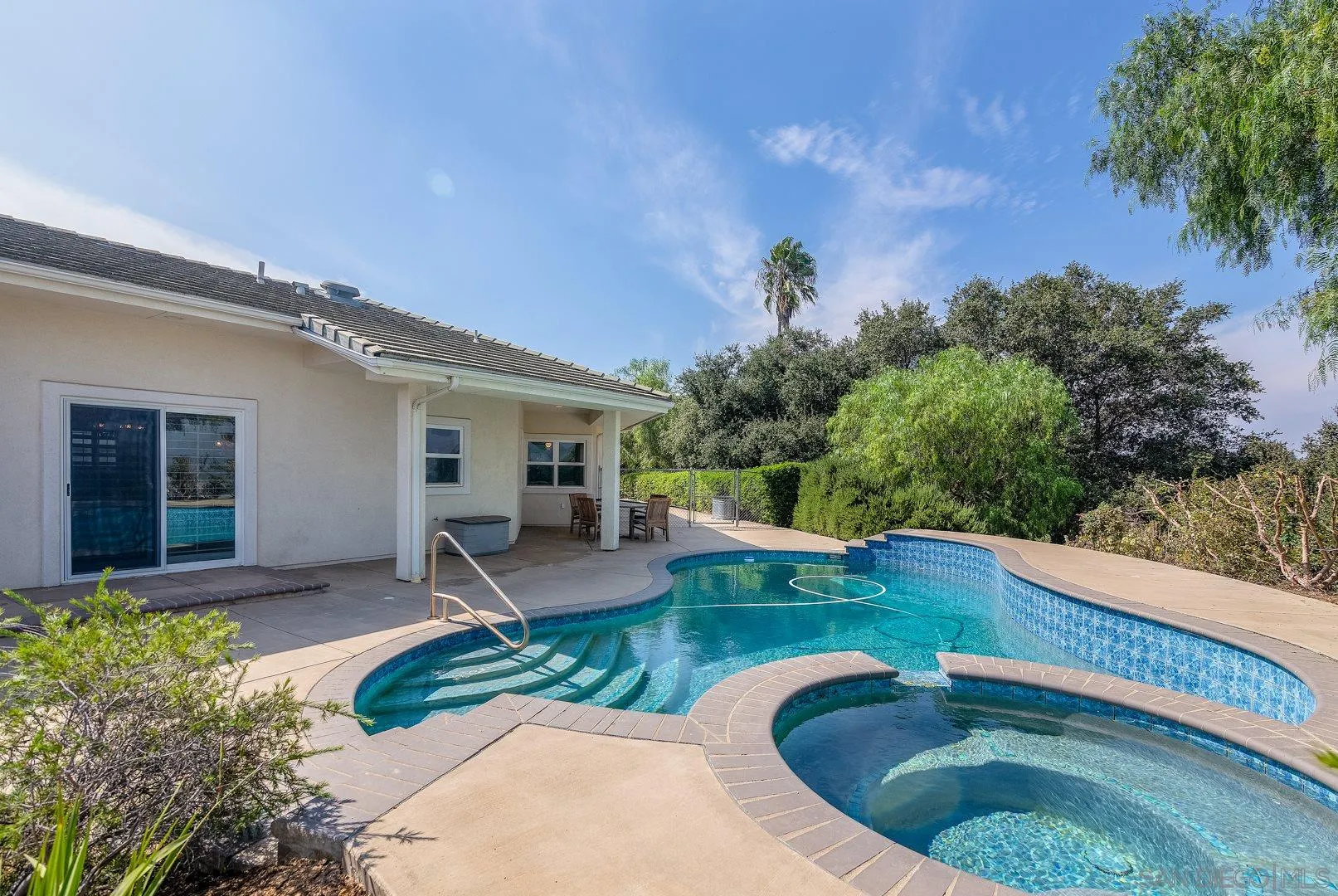 3880 Dos Ninos Road Fallbrook, CA 92028 - Photo 11 of 39 a view of a house with swimming pool and sitting area