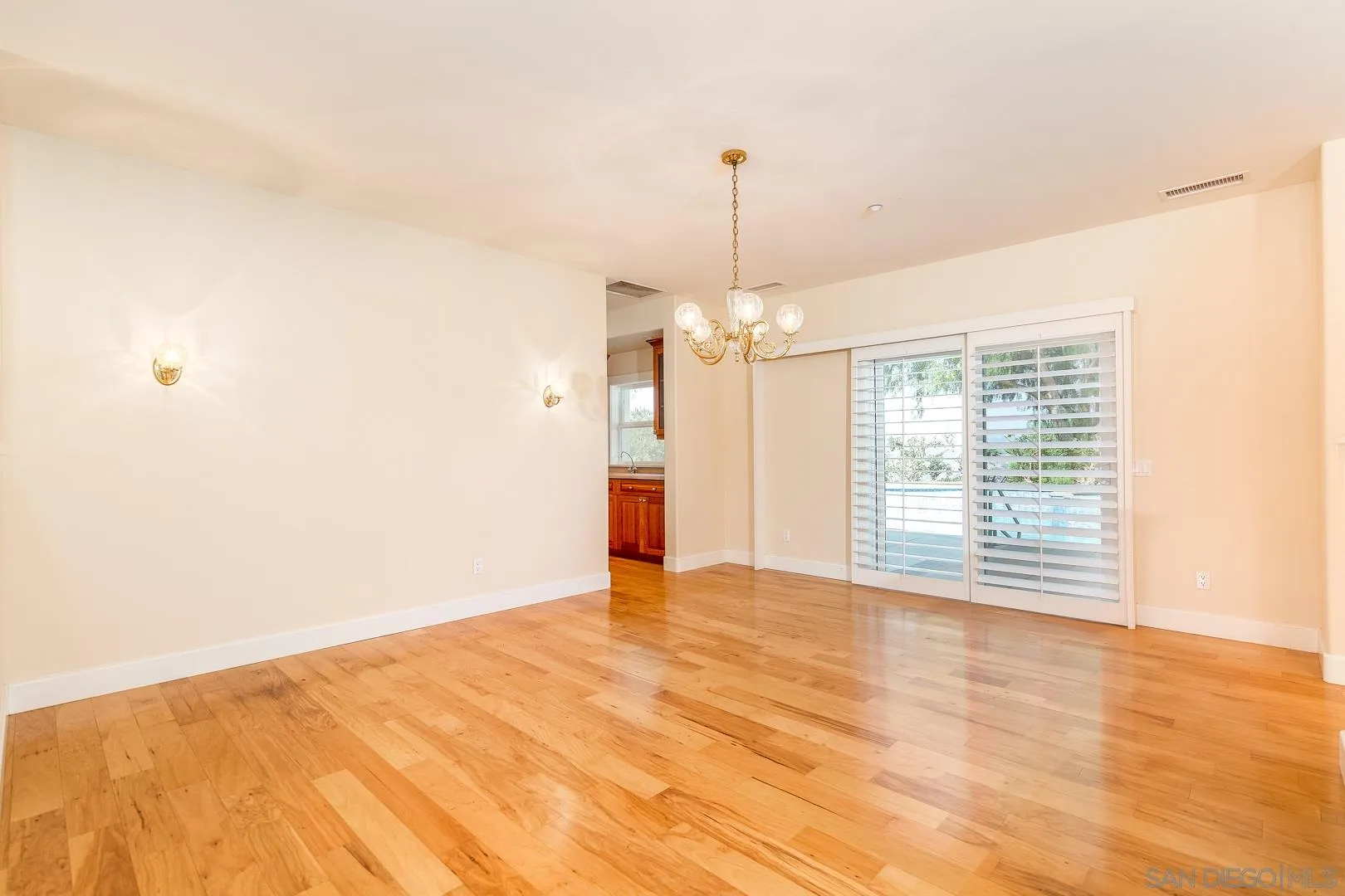 3880 Dos Ninos Road Fallbrook, CA 92028 - Photo 17 of 39 a view of empty room with wooden floor and fan