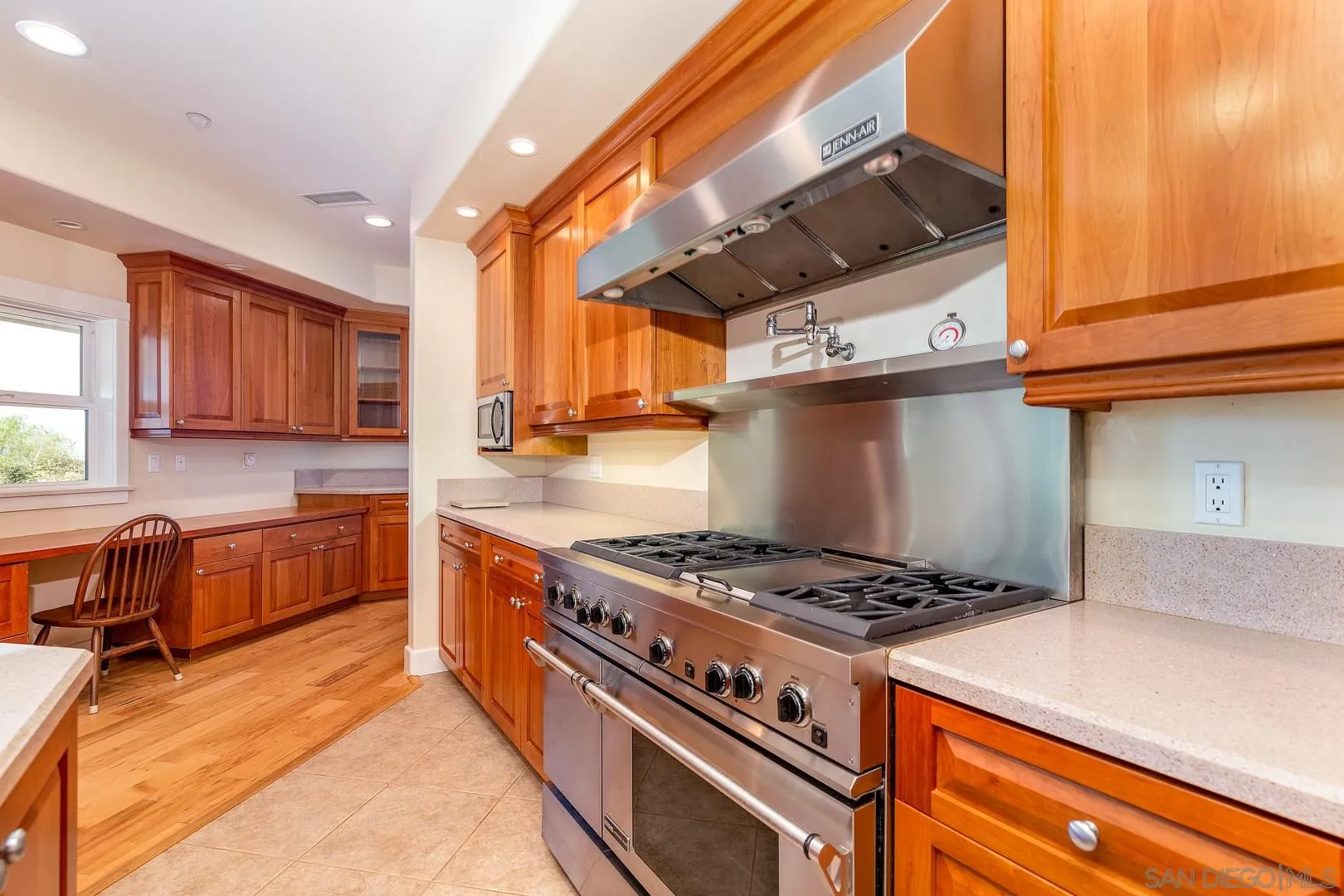 3880 Dos Ninos Road Fallbrook, CA 92028 - Photo 21 of 39 a kitchen with stainless steel appliances granite countertop a stove a sink and a microwave