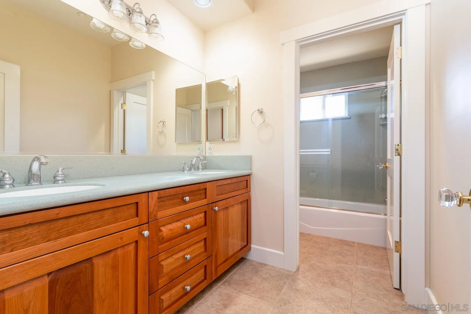 3880 Dos Ninos Road Fallbrook, CA 92028 - Photo 26 of 39 a bathroom with a granite countertop sink mirror and