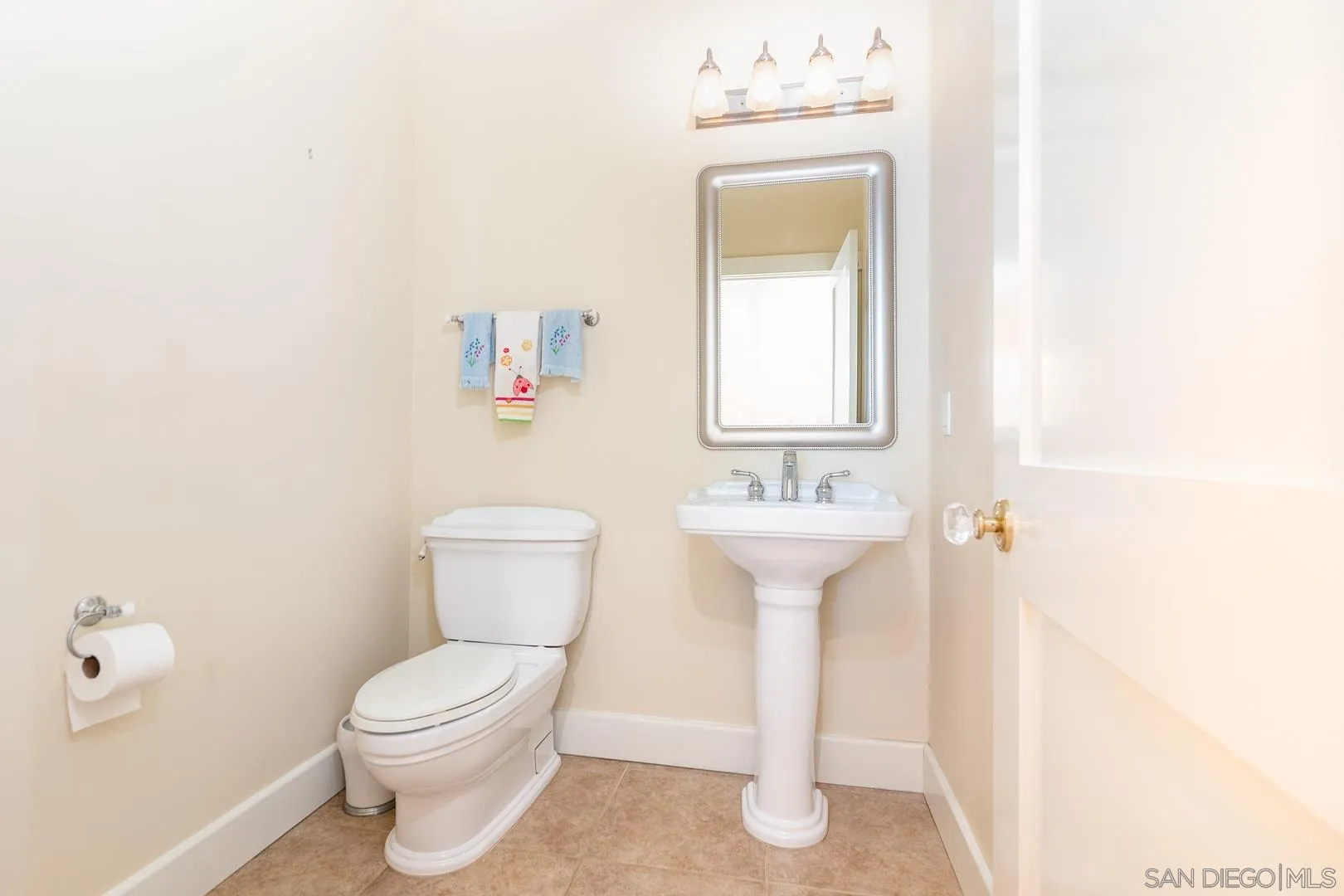 3880 Dos Ninos Road Fallbrook, CA 92028 - Photo 28 of 39 a bathroom with a sink toilet and a mirror