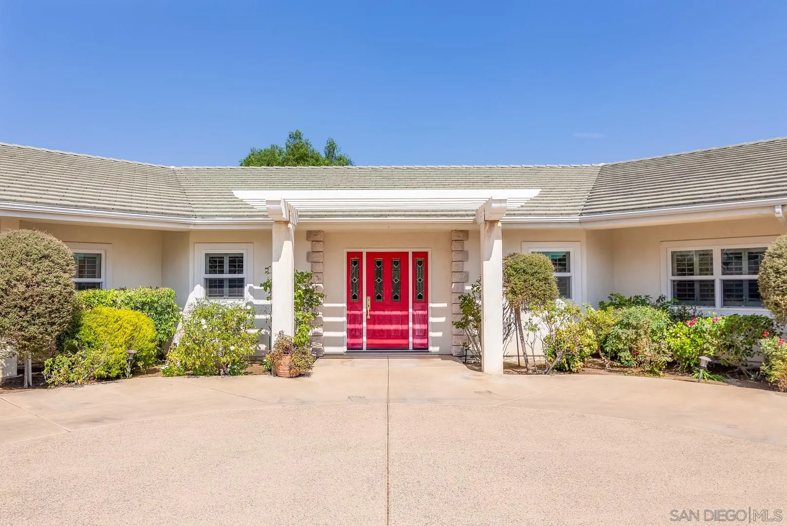 3880 Dos Ninos Road Fallbrook, CA 92028 - Photo 3 of 39 front view of a brick house with potted plants