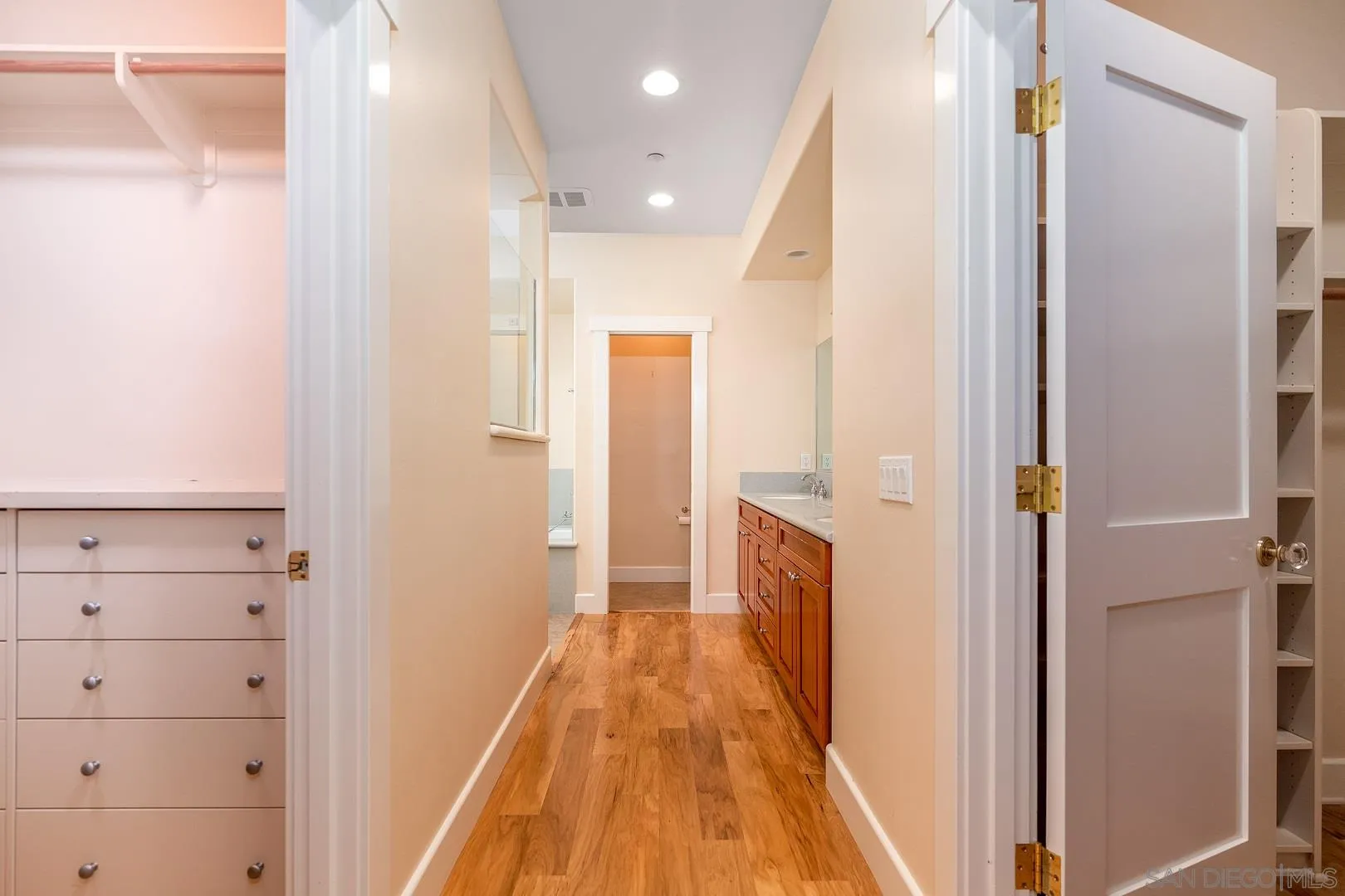 3880 Dos Ninos Road Fallbrook, CA 92028 - Photo 35 of 39 a view of a hallway with closet and mirror
