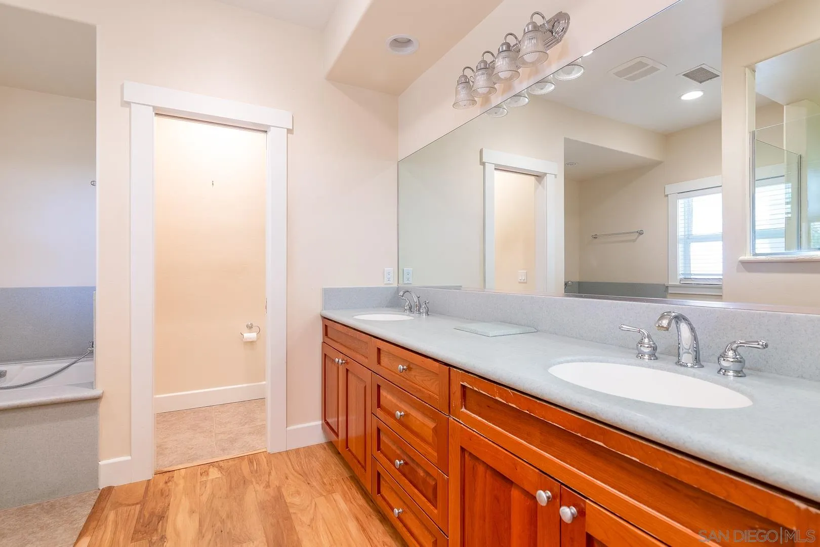 3880 Dos Ninos Road Fallbrook, CA 92028 - Photo 36 of 39 a bathroom with a granite countertop sink and a mirror