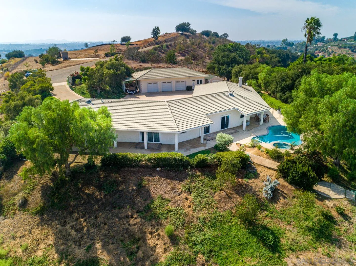 3880 Dos Ninos Road Fallbrook, CA 92028 - Photo 6 of 39 a view of a house with a yard and potted plants