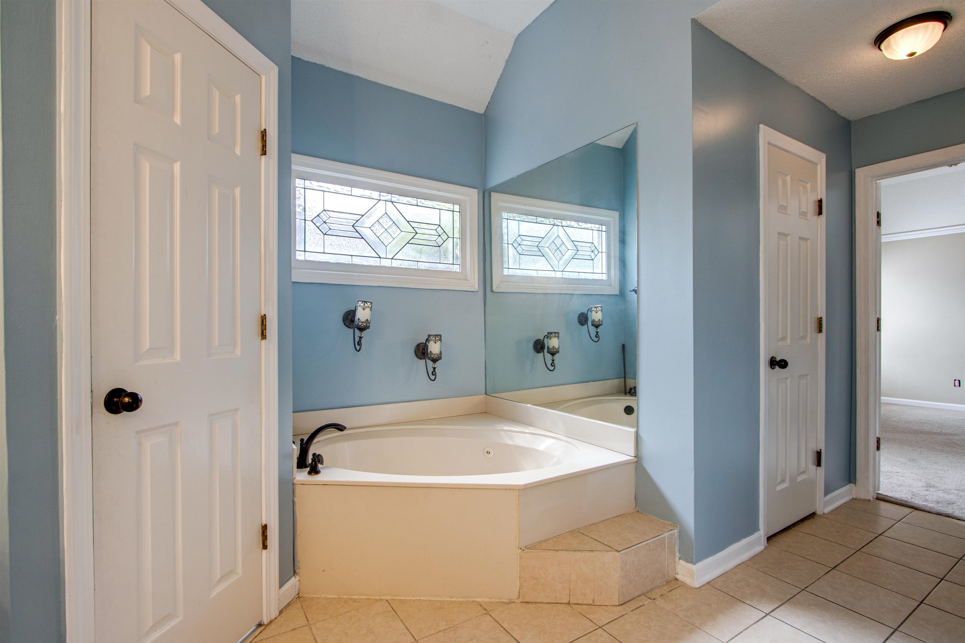 322 Walnut Trace Drive Memphis, TN 38018 - Photo 11 of 17 a bathroom with a tub and shower