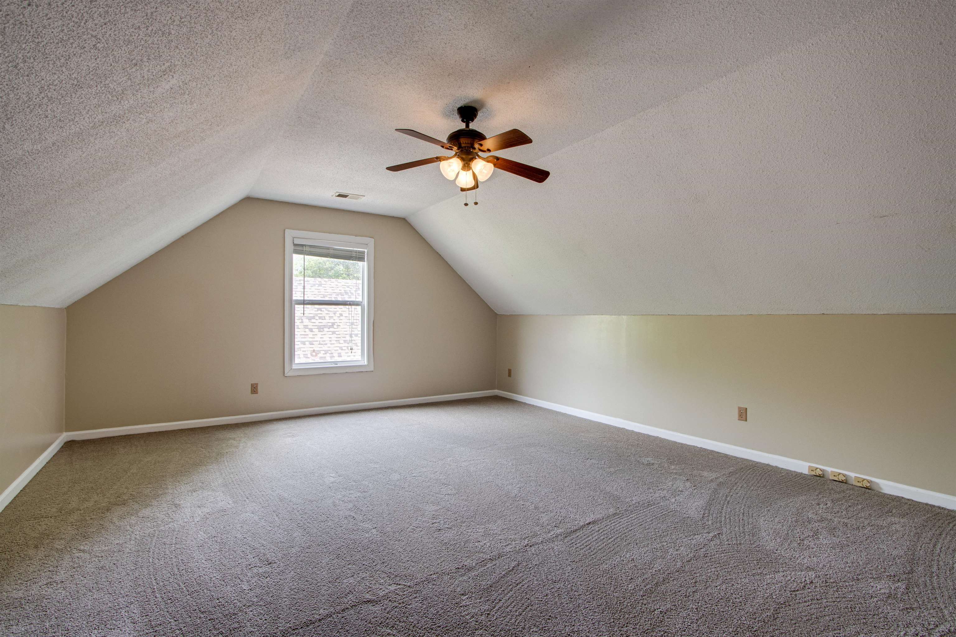 322 Walnut Trace Drive Memphis, TN 38018 - Photo 15 of 17 an empty room with a window and a ceiling fan