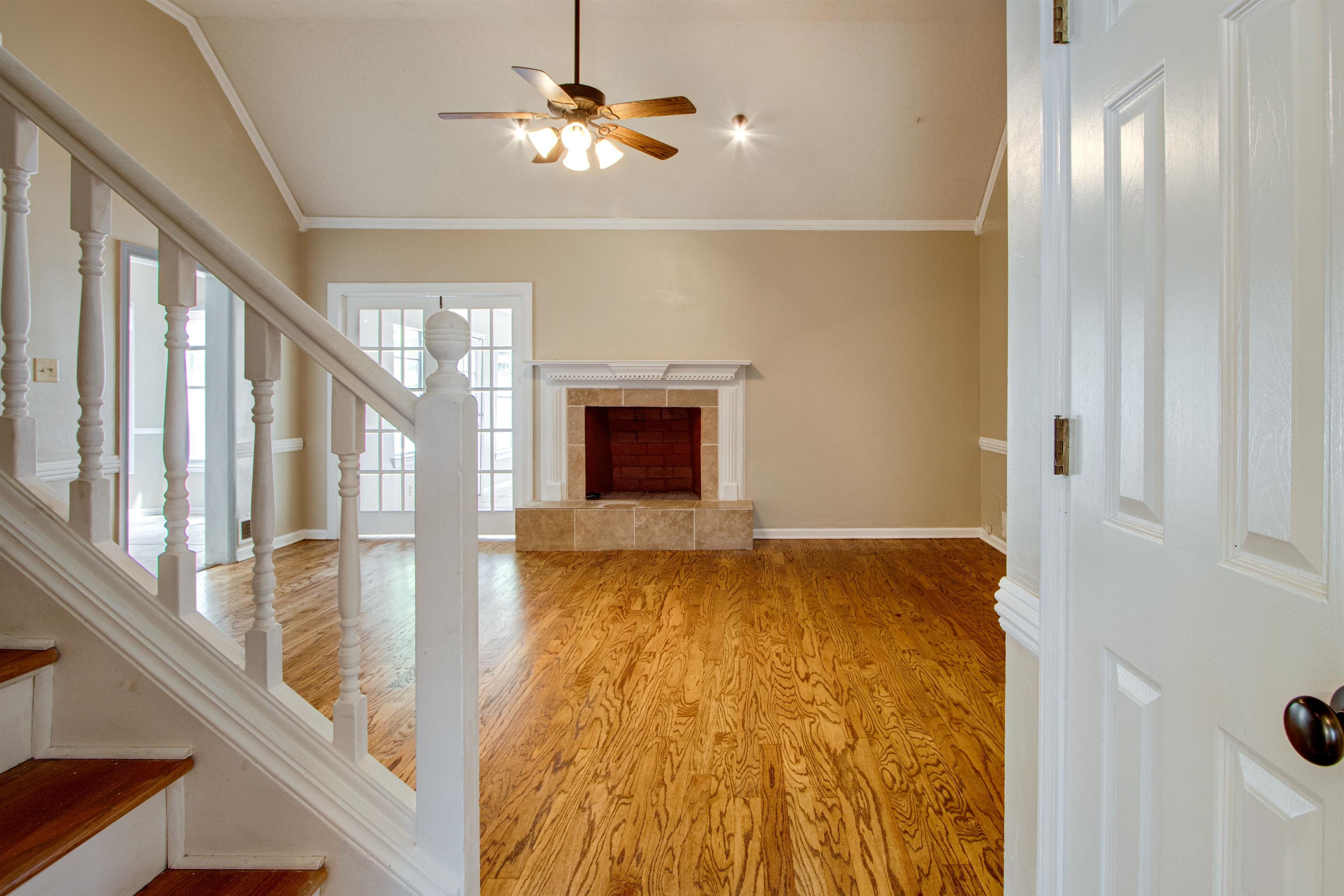 322 Walnut Trace Drive Memphis, TN 38018 - Photo 5 of 17 a view of an empty room and chandelier fan