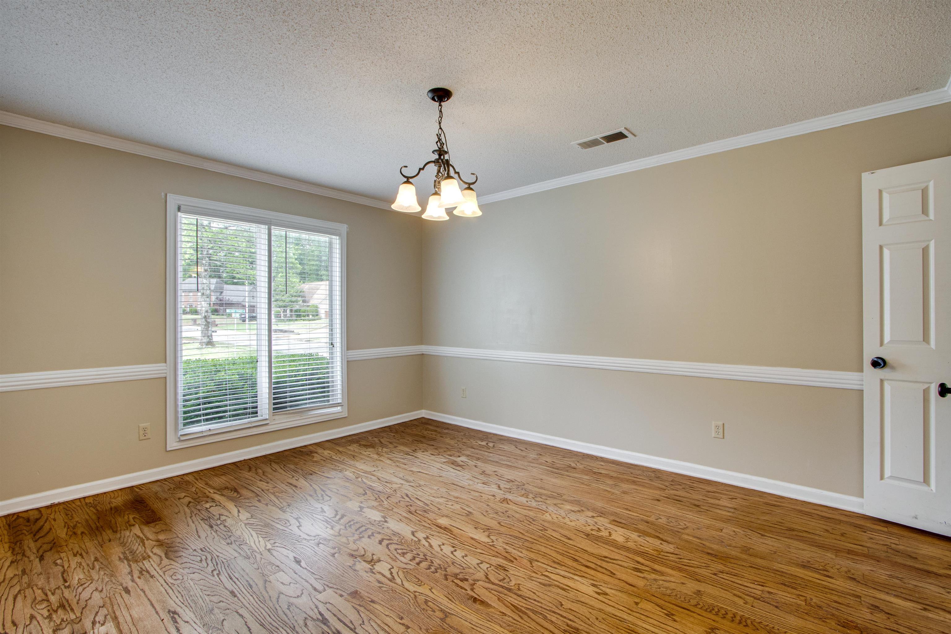322 Walnut Trace Drive Memphis, TN 38018 - Photo 6 of 17 a view of wooden floor and windows in a room