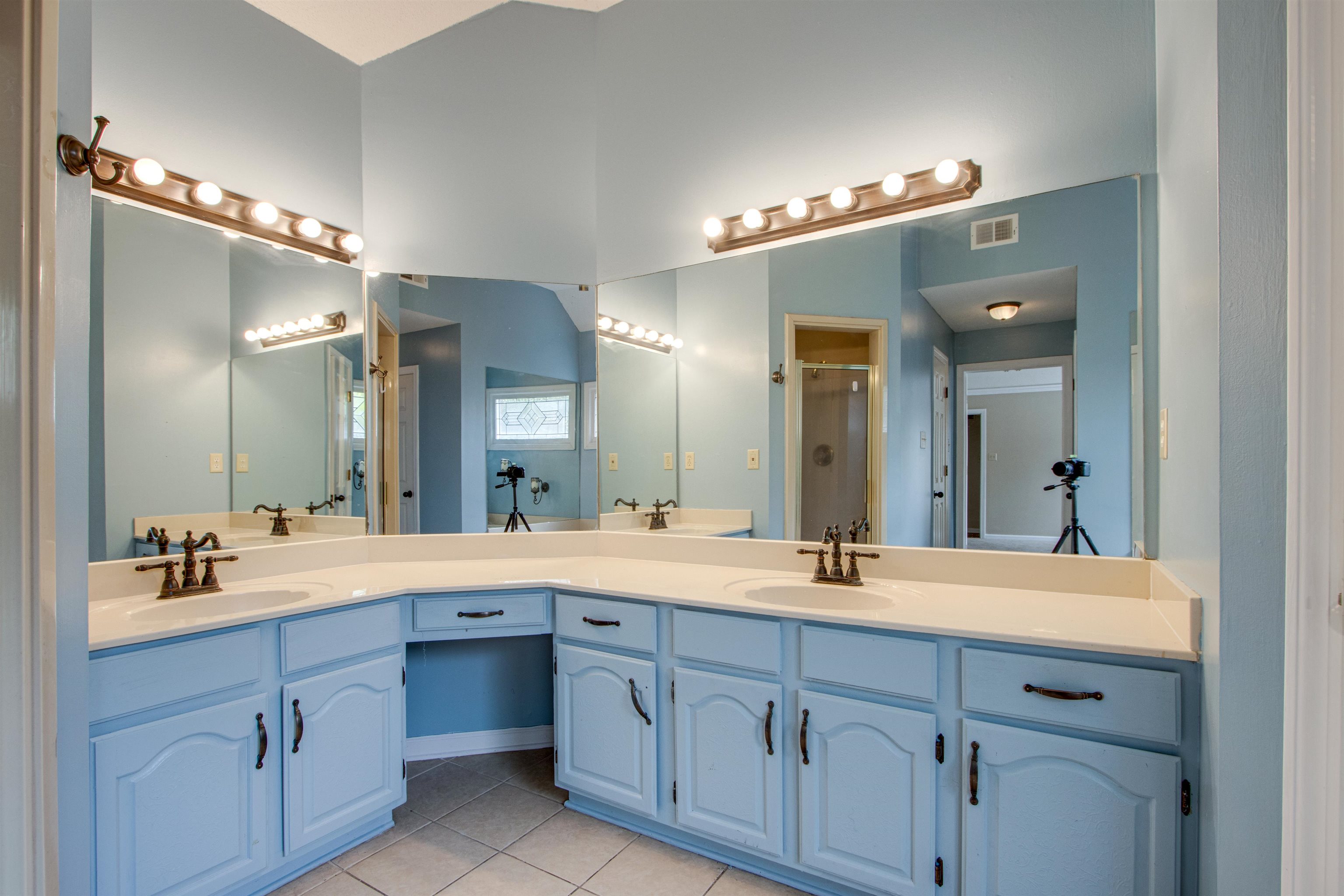 322 Walnut Trace Drive Memphis, TN 38018 - Photo 10 of 17 a bathroom with a double vanity sink and a mirror