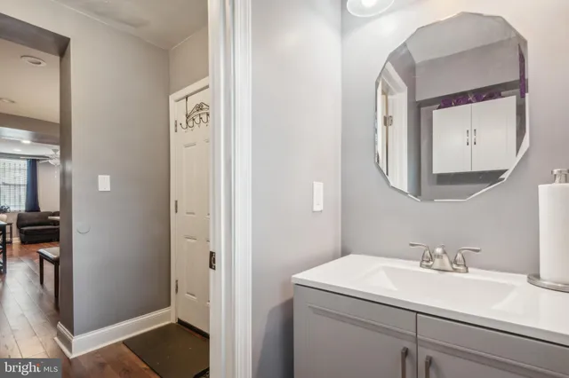 a bathroom with a sink and a mirror