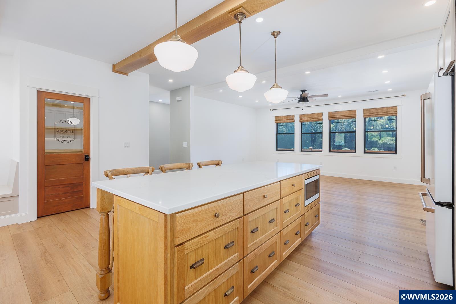 34370 Hawk Hill Road Philomath, OR 97370 - Photo 14 of 50 a room with stainless steel appliances kitchen island a large counter space and wooden floor