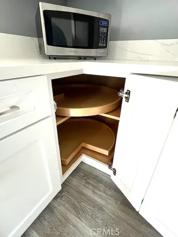 a bathroom with a sink and a microwave