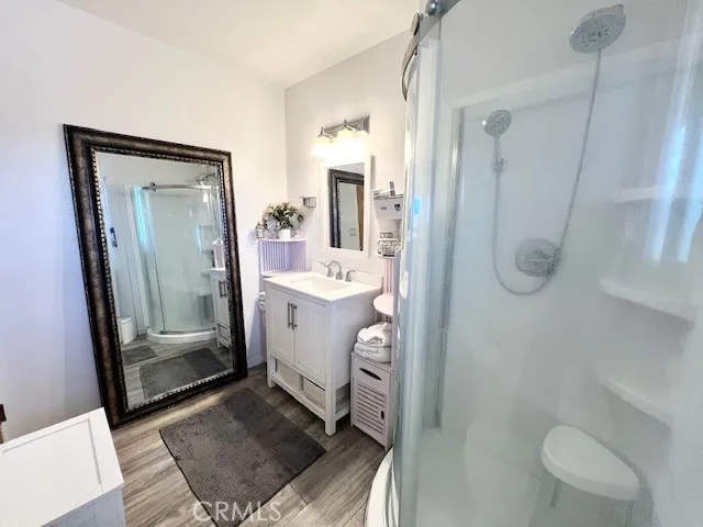 a bathroom with a sink a toilet a mirror and vanity