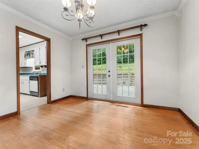 a kitchen with cabinets appliances a sink and a window