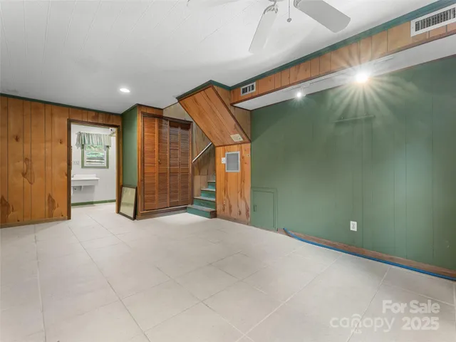 a bathroom with a sink mirror and a bathtub