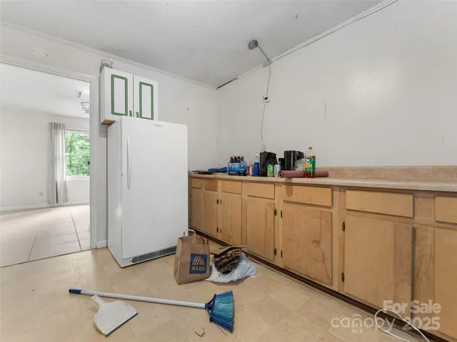 an empty room with a empty space and windows