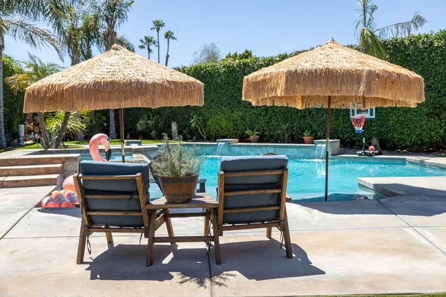 a view of a swimming pool with lounge chair