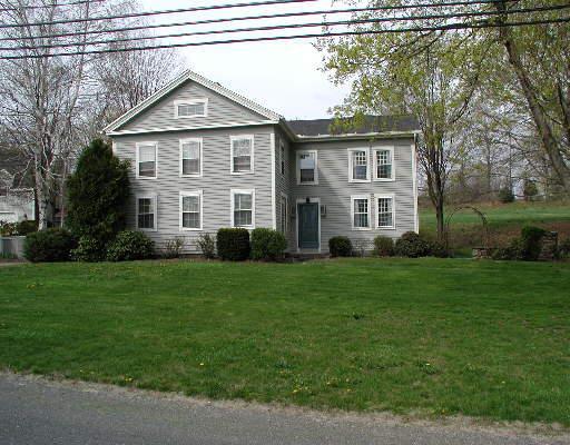 14 Quassuk Road, Unit 78 Woodbury, CT 06798 - Photo 1 of 1 a front view of a house with a yard and trees