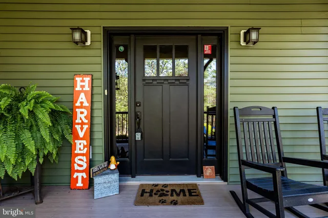a dining room with furniture window and wooden floor