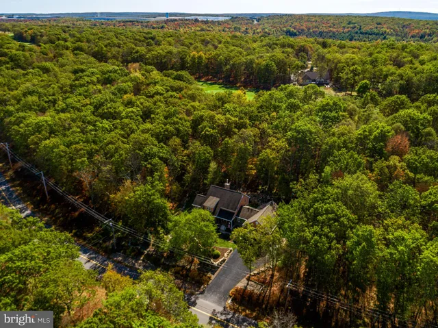 a living room with furniture a wooden floor and a window