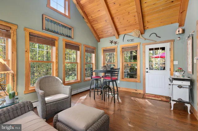 a bathroom with a sink toilet a mirror a vanity and shower