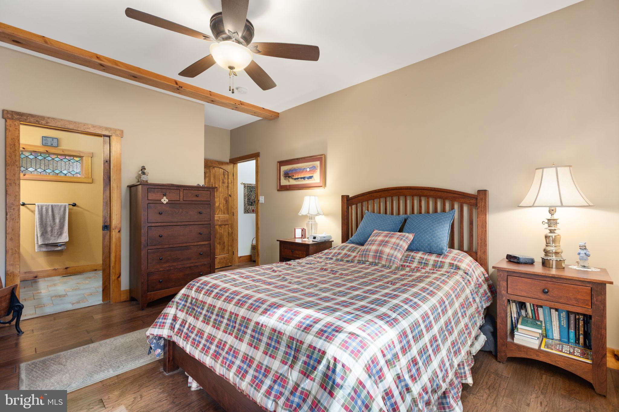248 Country Club Drive Hazleton, PA 18202 - Photo 39 of 91 a bedroom with a bed a dresser and a chandelier