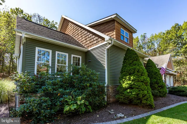 a view of a patio with a table and chairs