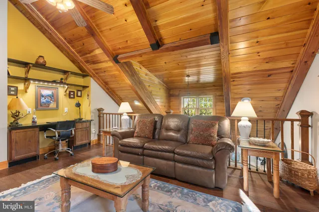 a swimming pool with outdoor seating and yard