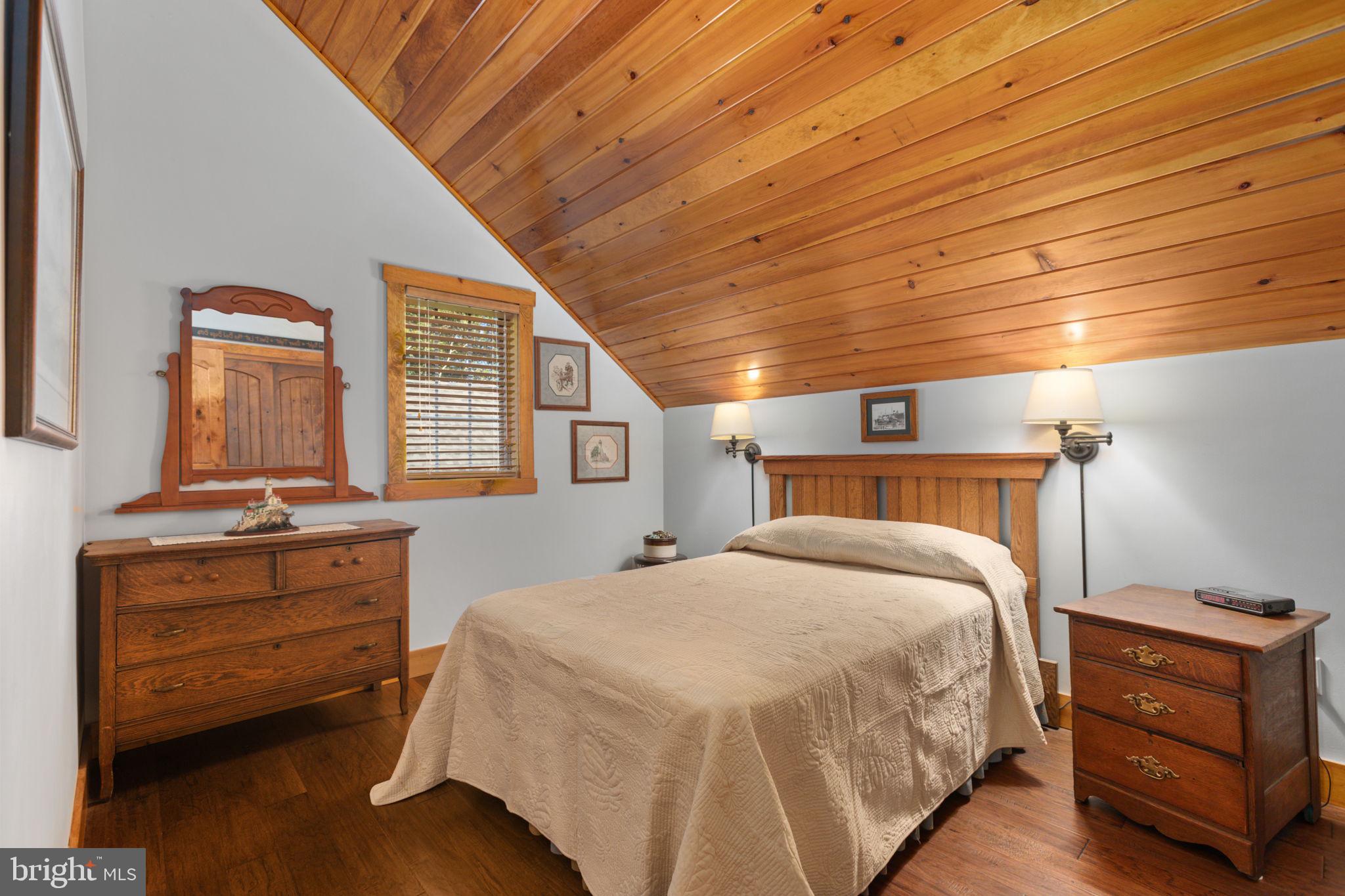 248 Country Club Drive Hazleton, PA 18202 - Photo 49 of 91 a bedroom with a bed and wooden floor