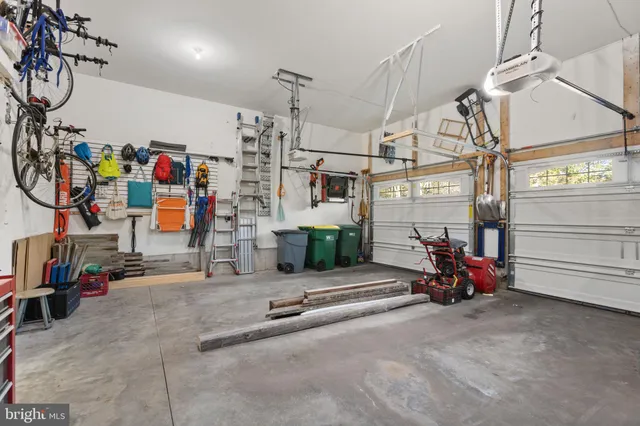 a view of a swimming pool with an outdoor seating and a yard