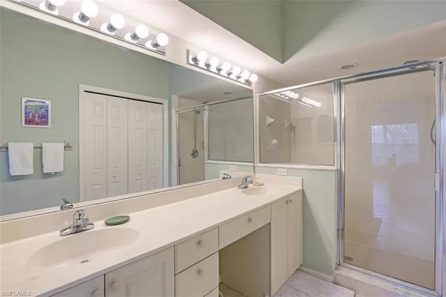 a bathroom with a double vanity sink mirror and double