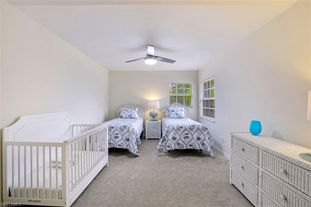 5630 Sherborn Drive, Unit 202 Naples, FL 34110 - Photo 14 of 18 a bedroom with bed and a window