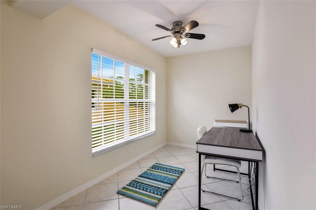 5630 Sherborn Drive, Unit 202 Naples, FL 34110 - Photo 15 of 18 a view of a workspace with furniture and a window