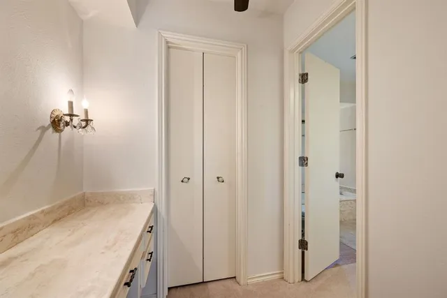 a bathroom with a granite countertop sink and shower