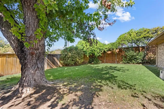 a backyard of a house with lots of green space