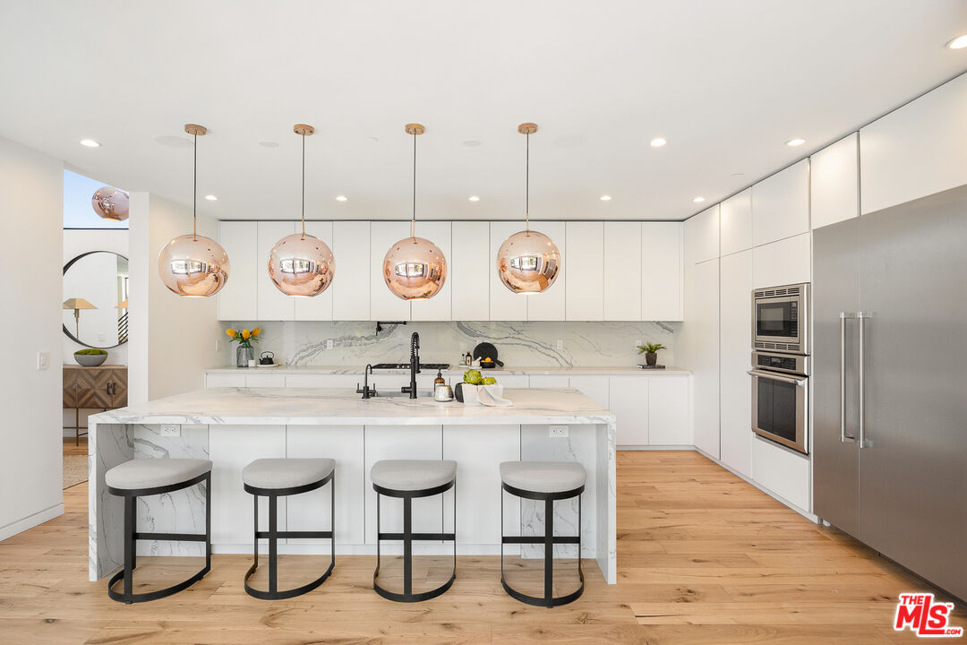 2624 Naples Avenue Venice, CA 90291 - Photo 11 of 38 a kitchen with lots of counter top space and appliances