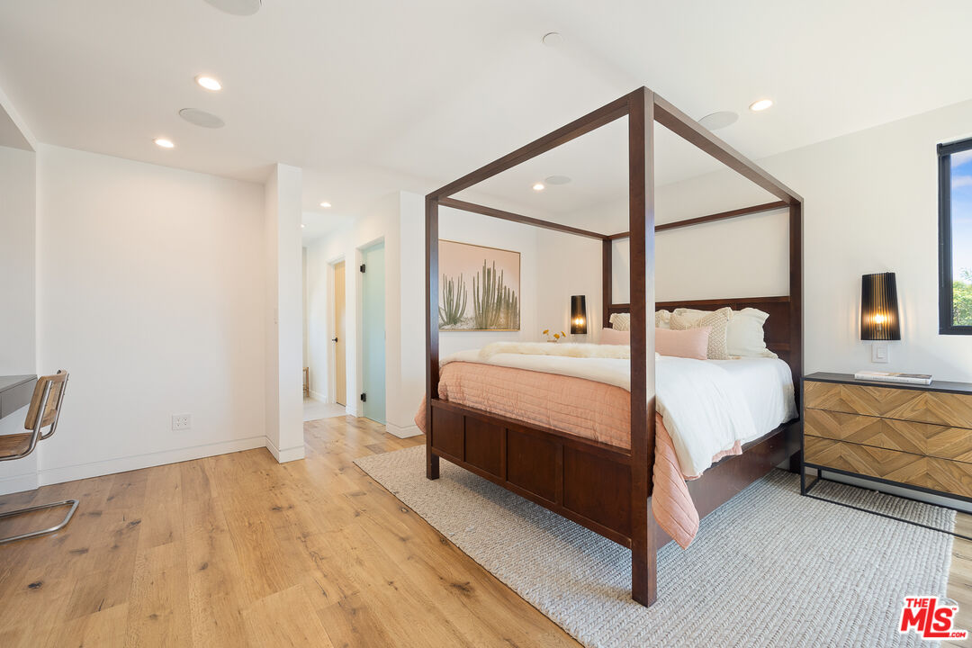 2624 Naples Avenue Venice, CA 90291 - Photo 29 of 38 a bedroom with a bed painting on wall and a large window