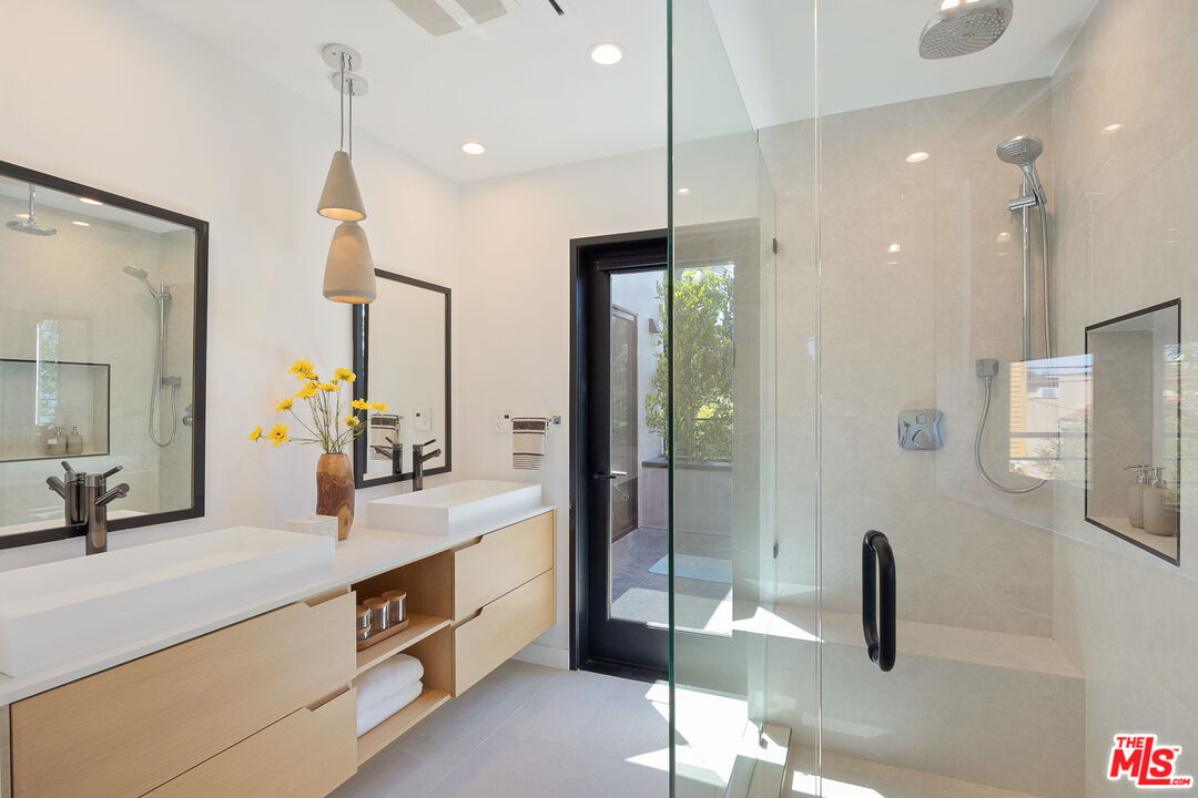 2624 Naples Avenue Venice, CA 90291 - Photo 31 of 38 a bathroom with a sink and a mirror