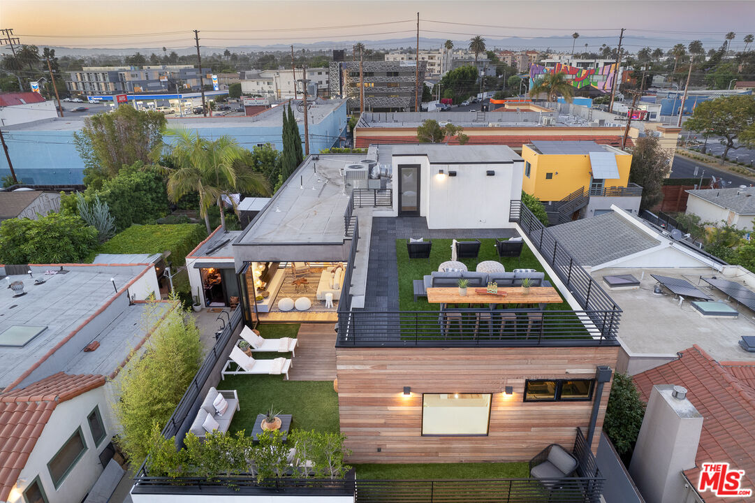 2624 Naples Avenue Venice, CA 90291 - Photo 35 of 38 an aerial view of a house with a swimming pool a yard and lake view