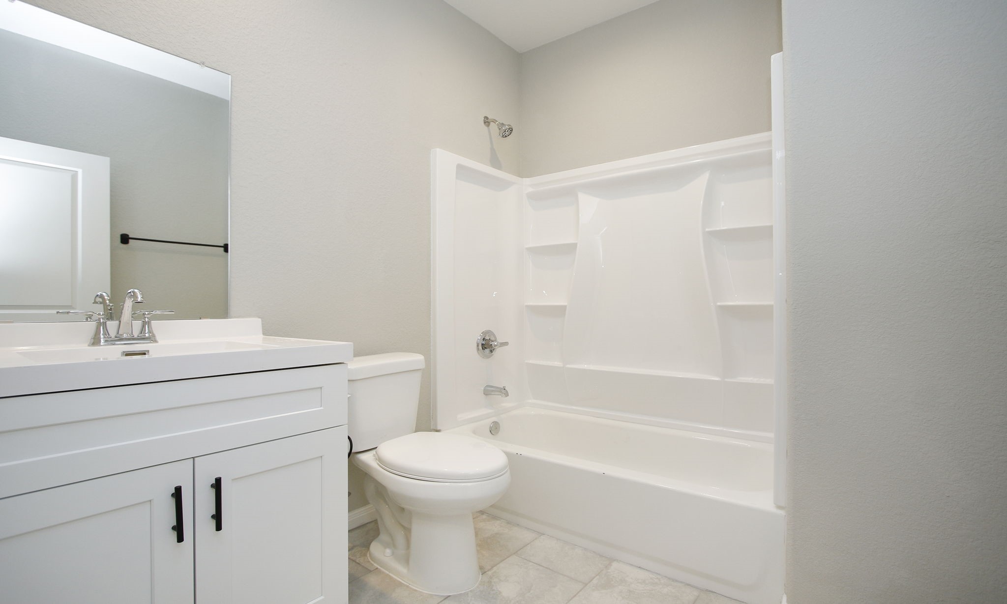 14010 Longstreet Road, Unit 4 Willis, TX 77318 - Photo 30 of 42 a bathroom with a sink a toilet and shower