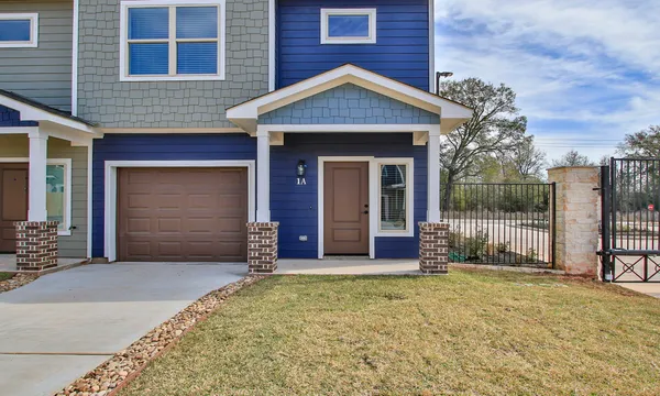 front view of a house with a yard