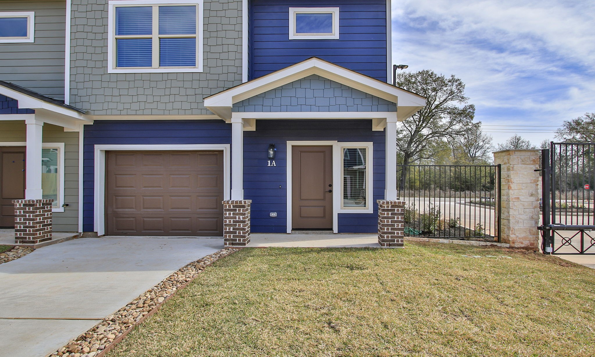 14010 Longstreet Road, Unit 4 Willis, TX 77318 - Photo 4 of 42 front view of a house with a yard