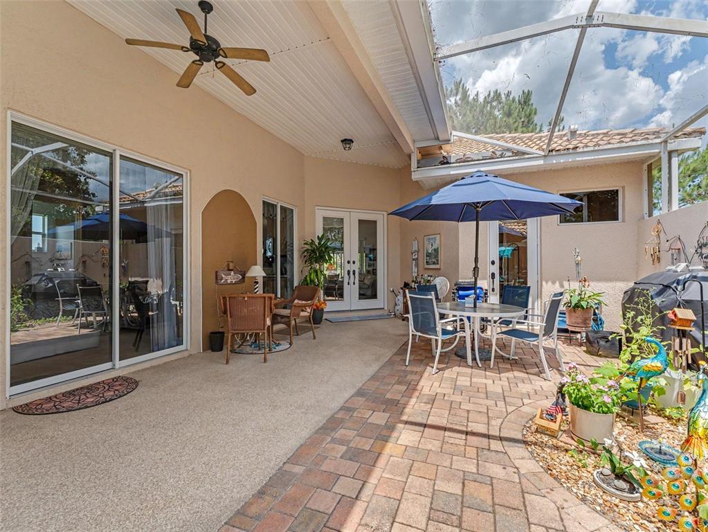 8910 Jericho Road Weeki Wachee, FL 34613 - Photo 15 of 52 a view of a patio with table and chairs under an umbrella