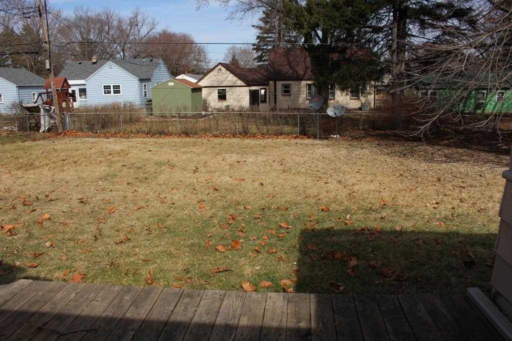 4212 Highcrest Road Rockford, IL 61107 - Photo 4 of 14 a view of a house with a yard