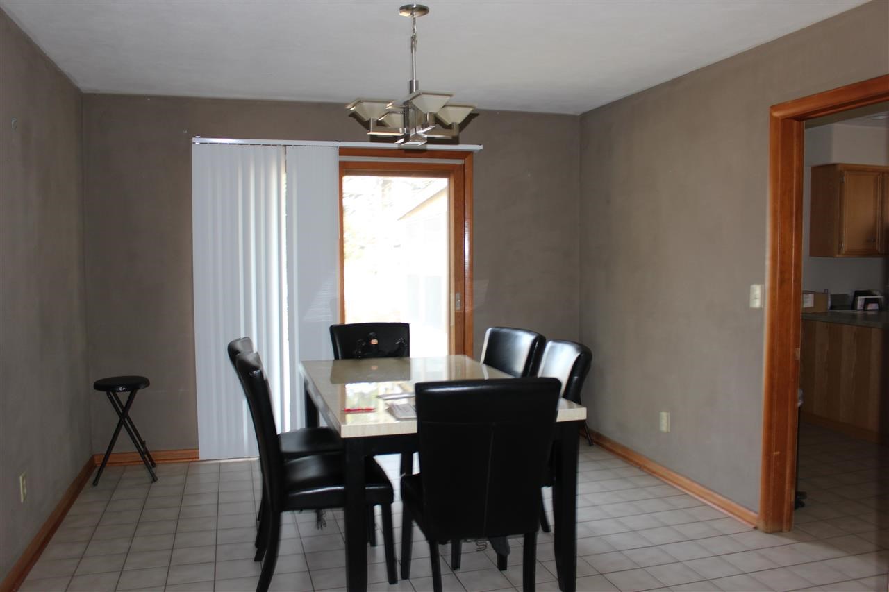 4212 Highcrest Road Rockford, IL 61107 - Photo 7 of 14 a view of a dining room with a table and chairs