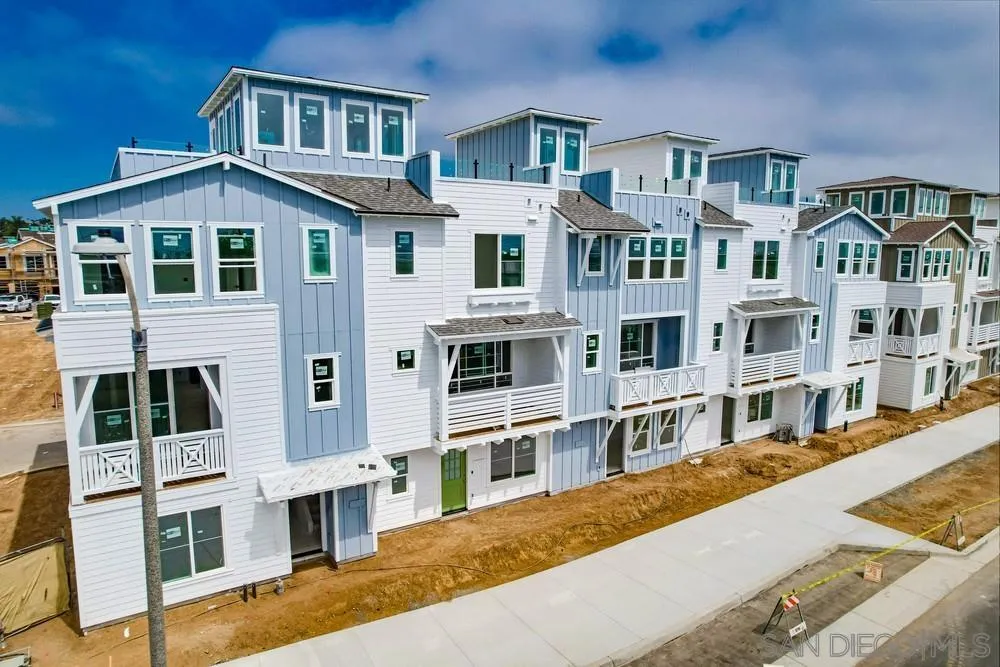 7064 Ponto Road Carlsbad, CA 92011 - Photo 2 of 28 a front view of residential houses with street