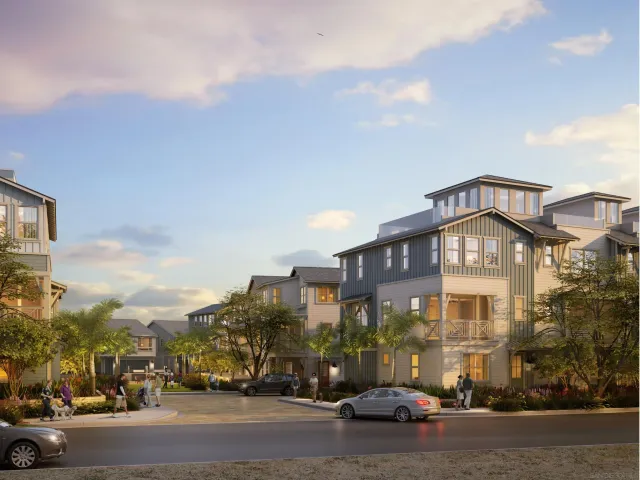 a view of a building and a cars parked on the side of street